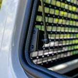 close up of the gas strut on an installed gullwing window troopy
