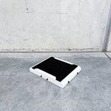 top view of white starlink mini mount to fit front runner roof rack