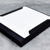 close up corner view of black starlink roof rack mounting kit with white cover