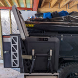 fridge in use with stowed patriot camper side table